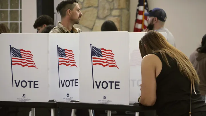 A voter fills out a ballot at a voting booth during the November 2025 election in Doña Ana County.
