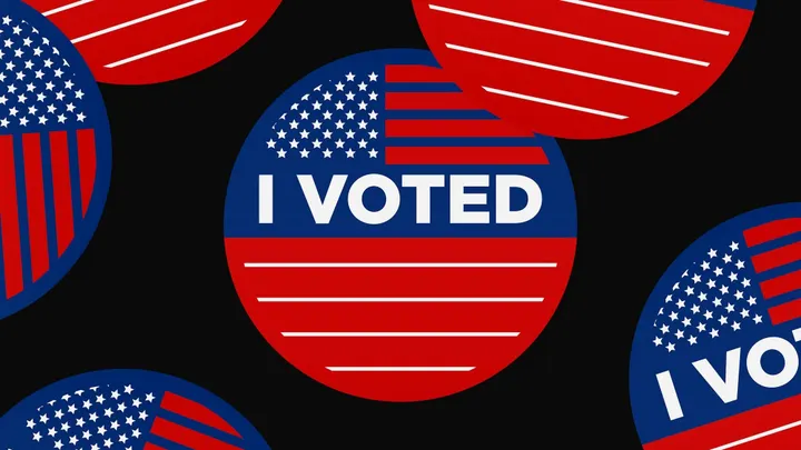 An illustration shows several red, white and blue “I Voted” stickers against a black background.