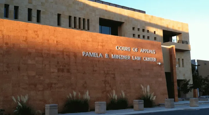 The New Mexico Court of Appeals building in Albuquerque, with the court name displayed on a stone wall.
