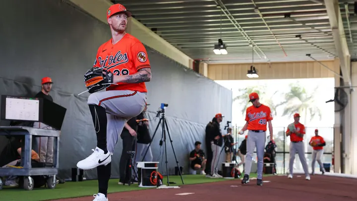 Baltimore Orioles pitcher Kyle Bradish throws during a spring training bullpen session.