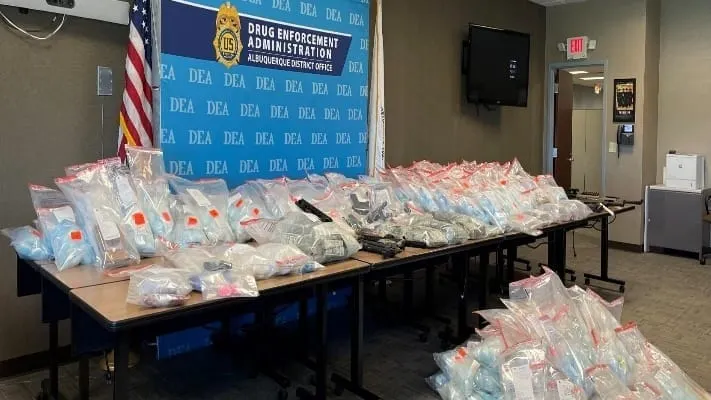 Cash, packaged drugs and other evidence seized during a federal fentanyl investigation in New Mexico.