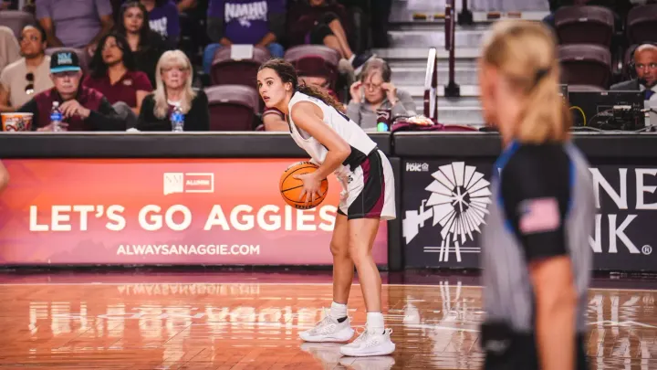 NM State women’s basketball player Emma Christiano holds the ball during a game.