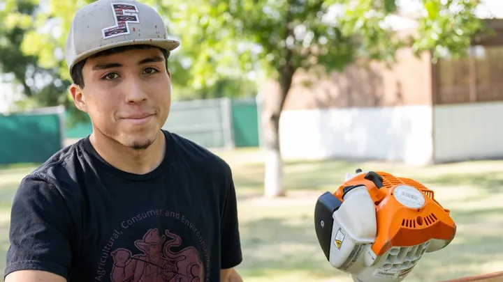 NMSU freshman Santiago Gamboa works outdoors during his summer internship at Mesilla Valley Maze in Las Cruces.
