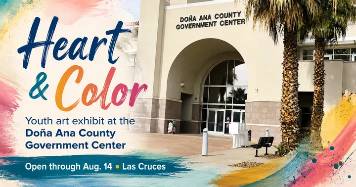 A colorful graphic for the Heart & Color youth art exhibit overlays the Doña Ana County Government Center and notes the exhibit is open through Aug. 14 in Las Cruces.