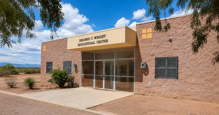 The Delores C. Wright Educational Center in Chaparral, a tan and brown brick building with a covered entrance and desert landscaping.