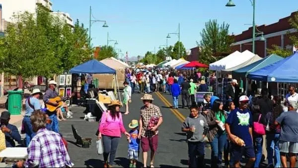Crowds browse vendor tents lining Main Street during the Farmers & Crafts Market of Las Cruces.