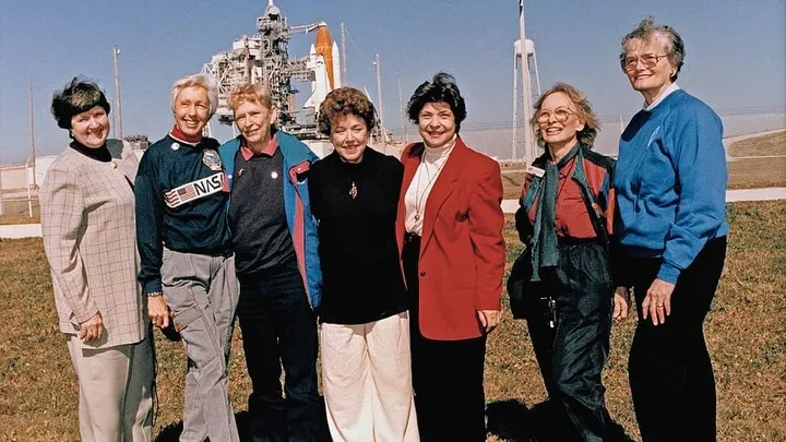 Seven members of the Mercury 13 gather during a visit to a space center. The pioneering women pilots will enter the International Space Hall of Fame Oct. 3.