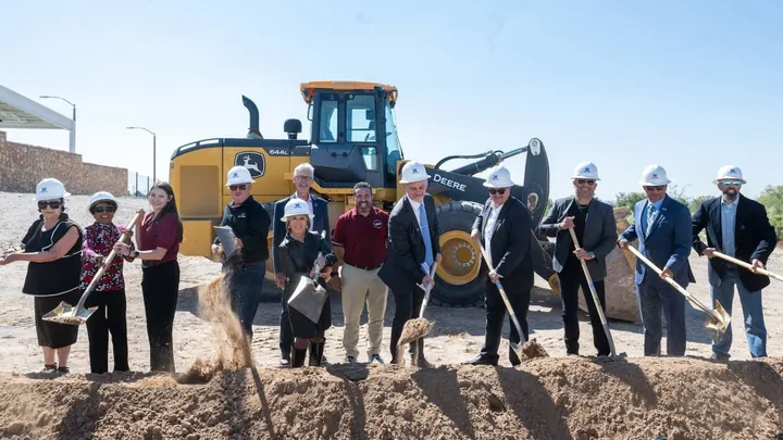 State and local officials in hard hats pose with shovels at the Arrowhead Studios groundbreaking at NMSU’s Arrowhead Park in Las Cruces.