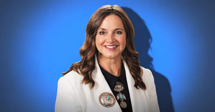 New Mexico House Republican Caucus Chair Rebecca Dow, R-Truth or Consequences, poses for a portrait against a blue background.