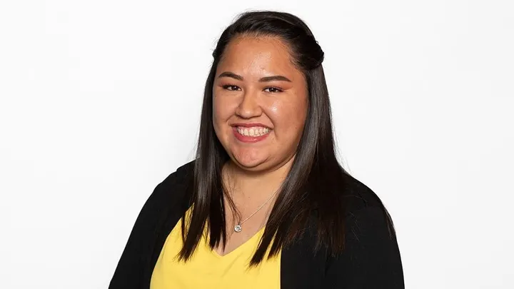 Jessica Castro-Buelna of Inspira STEAM Academy in Las Cruces smiles for a professional portrait against a white background.