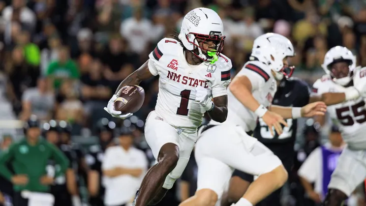 NM State wide receiver TK King runs with the football during the Aggies’ game against Hawaii in Honolulu.
