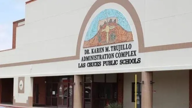 Exterior of the Dr. Karen M. Trujillo Administration Complex, with the Las Cruces Public Schools name displayed below a colorful mosaic above the entrance.