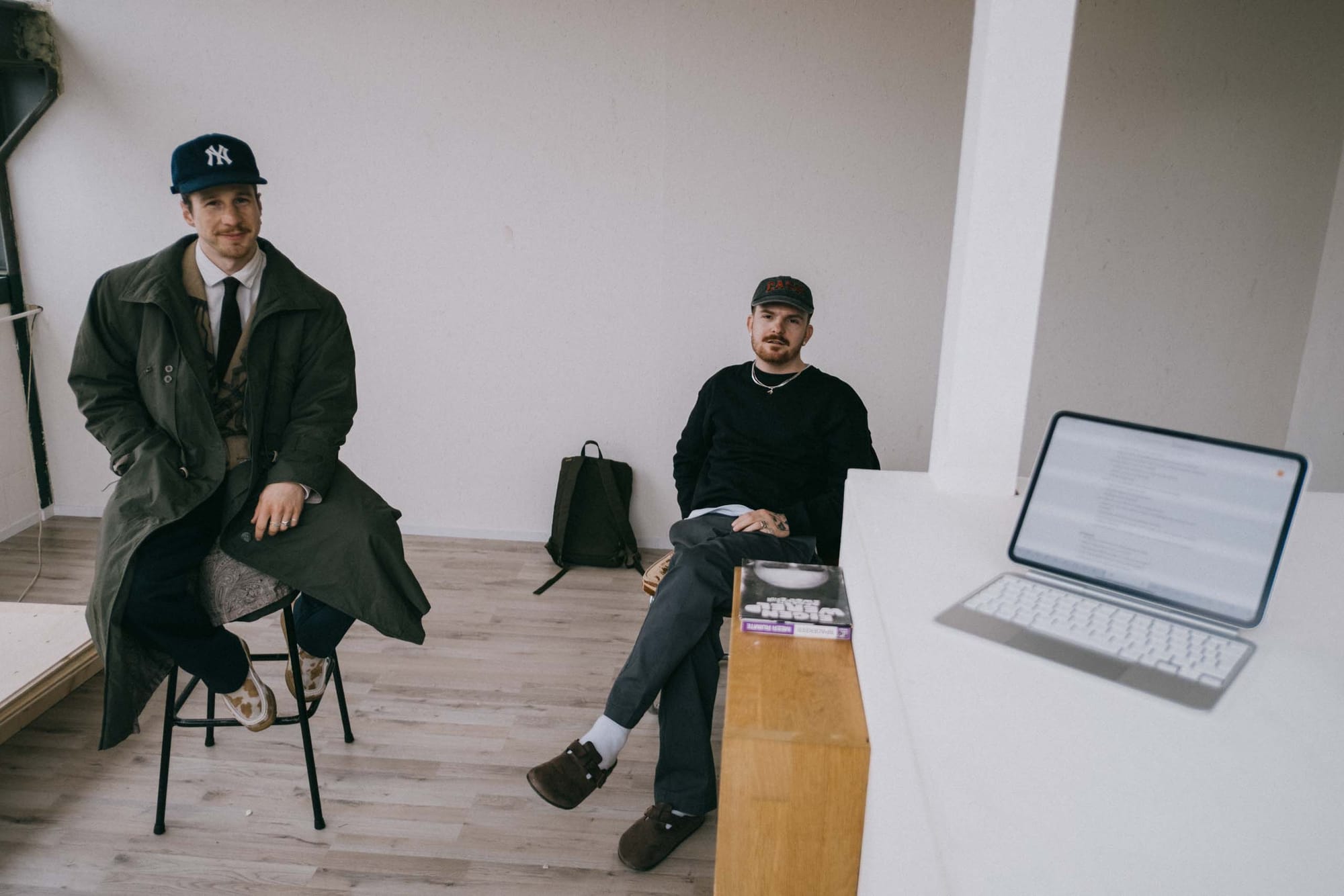 Bram Ravenhorst and Rafaël Stomp sitting on chairs, looking at me and my iPad.