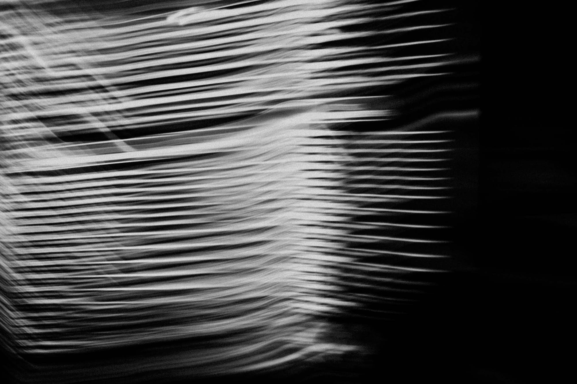 sample image with Fujifilm XF35mm f2 at f2 — Berlin, Germany — abstract motion blur of illuminated lines in a dark urban scene