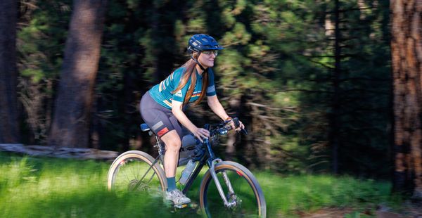Girl on bicycle descending a trai