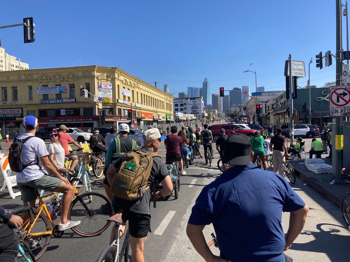 Cyclists wait for the light during CicLAvia.