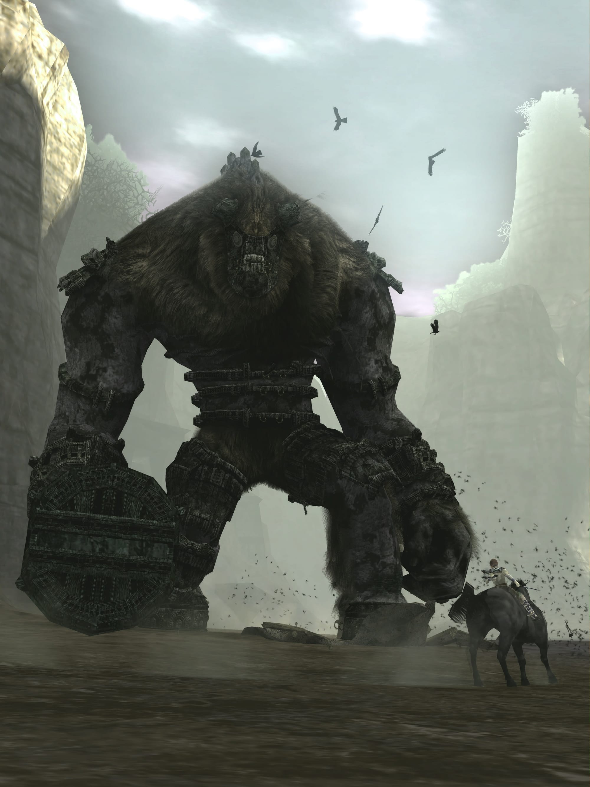 A vertically-oriented screenshot shows Wander riding his horse Agro in front of the game's first colossus.