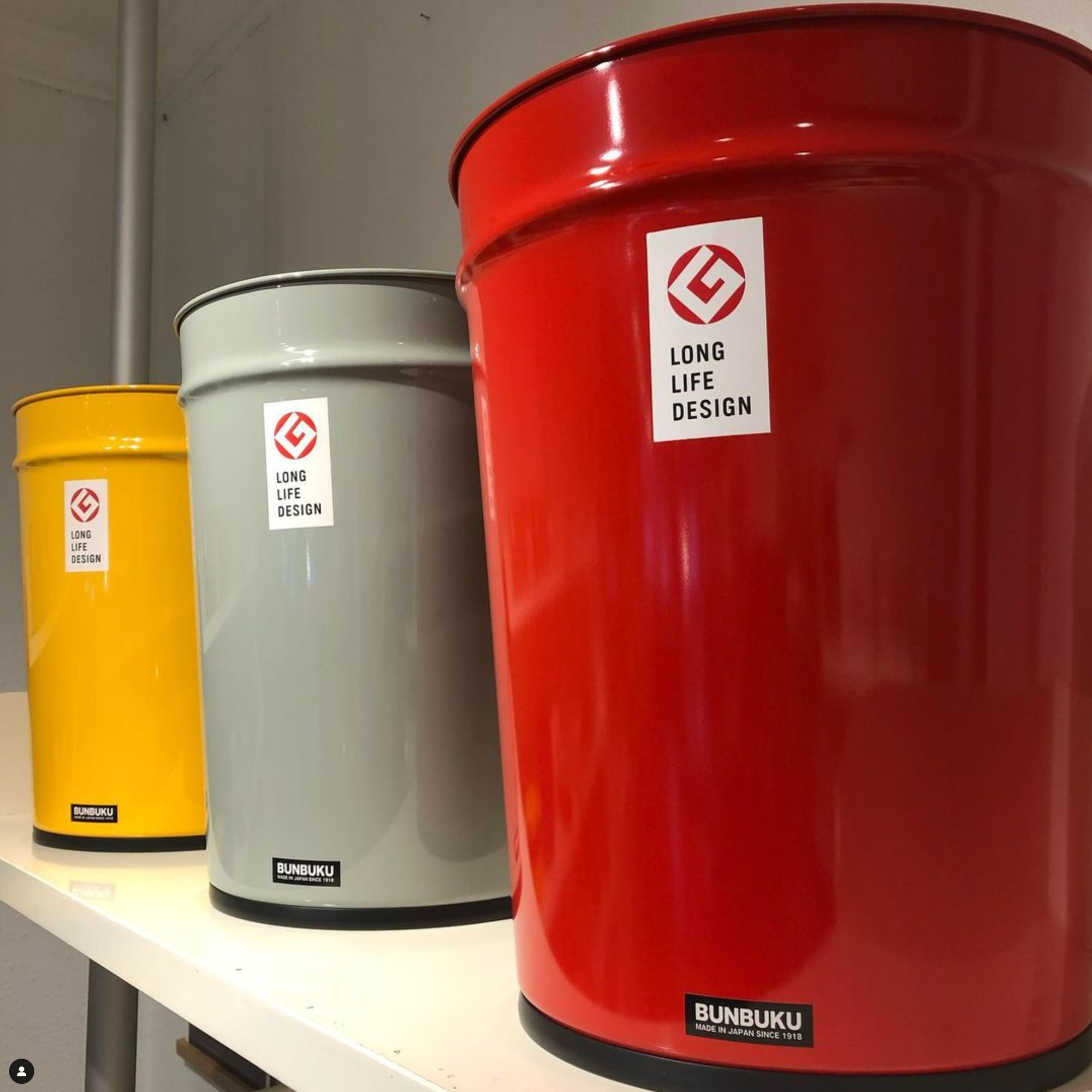 a photo of 3 bunbuku trashcans