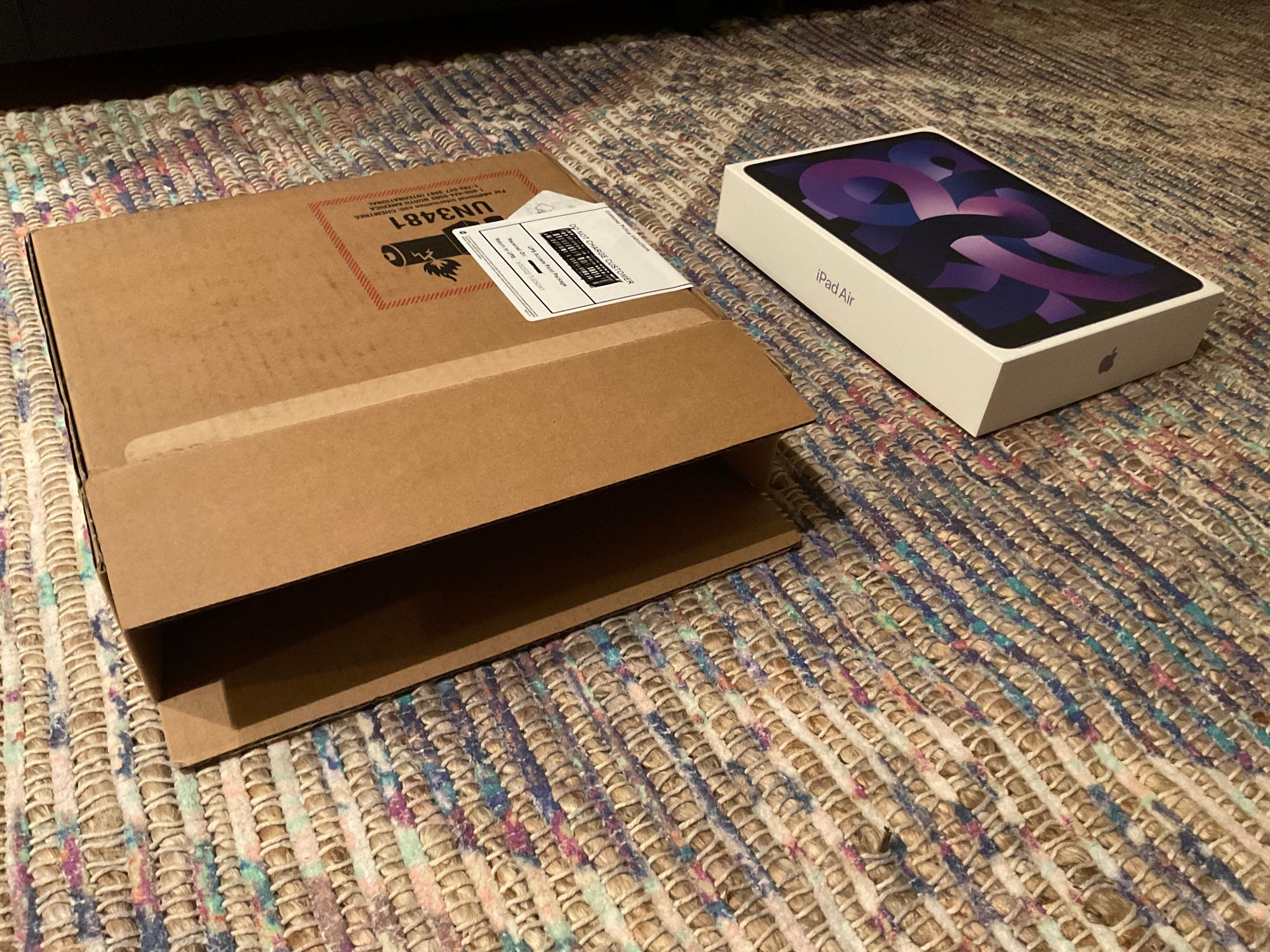 A photo of the cardboard shipping box and the actual iPad Air product box that the iPad Air came in.