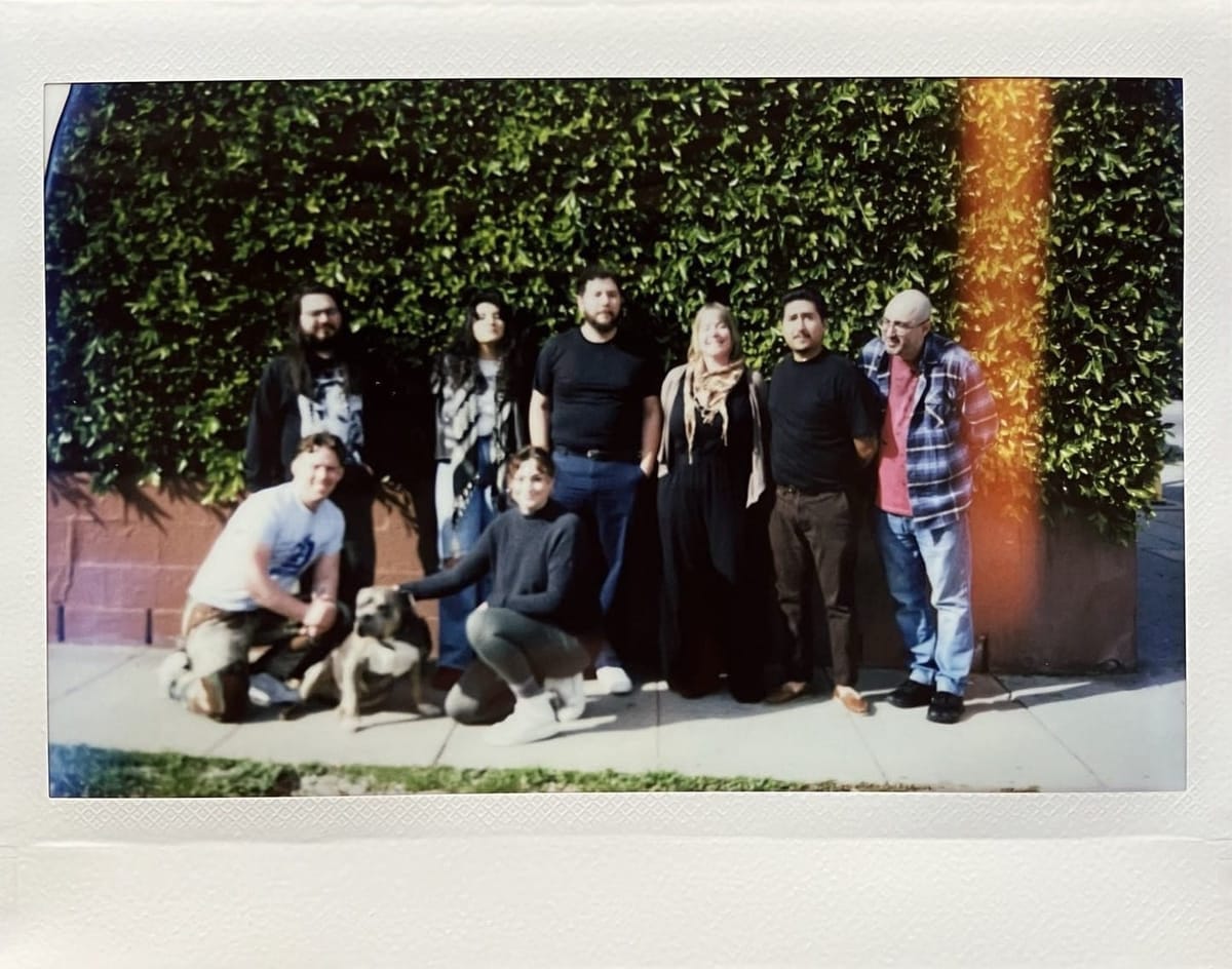 A Polaroid photo of The Southlander's team.