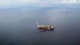 Aerial view of an offshore oil production and exploration platform operating in deep open ocean waters at Nigeria's largest deep-water field, Agbami.