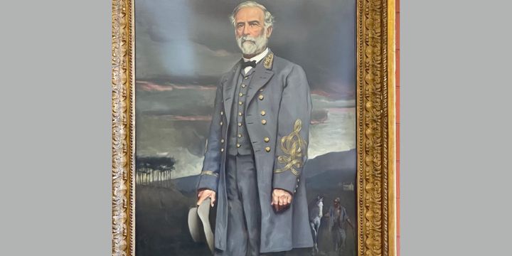 Portrait of General Robert E. Lee with a slave leading his horse behind him.