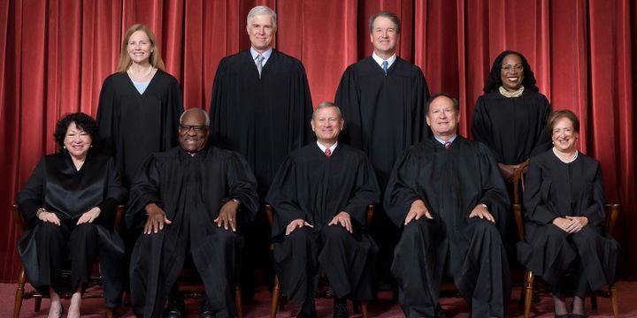 Formal group photograph of the Supreme Court. From left: Justices Sotomayor, Barrett, Thomas, Gorsuch,  Roberts, Cavanagh, Alito, Jackson, and Kagan.