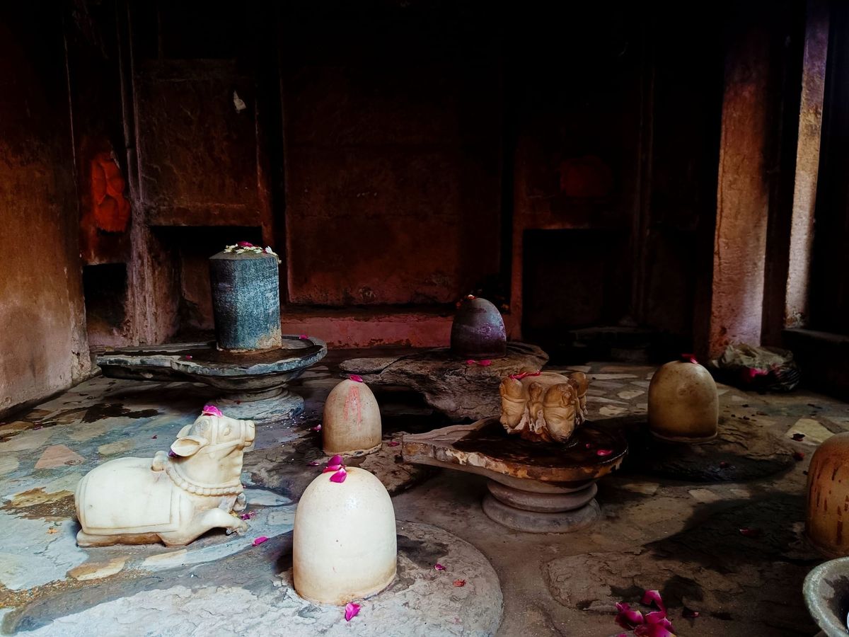 A small temple with Shiva lingas on a street in Banaras