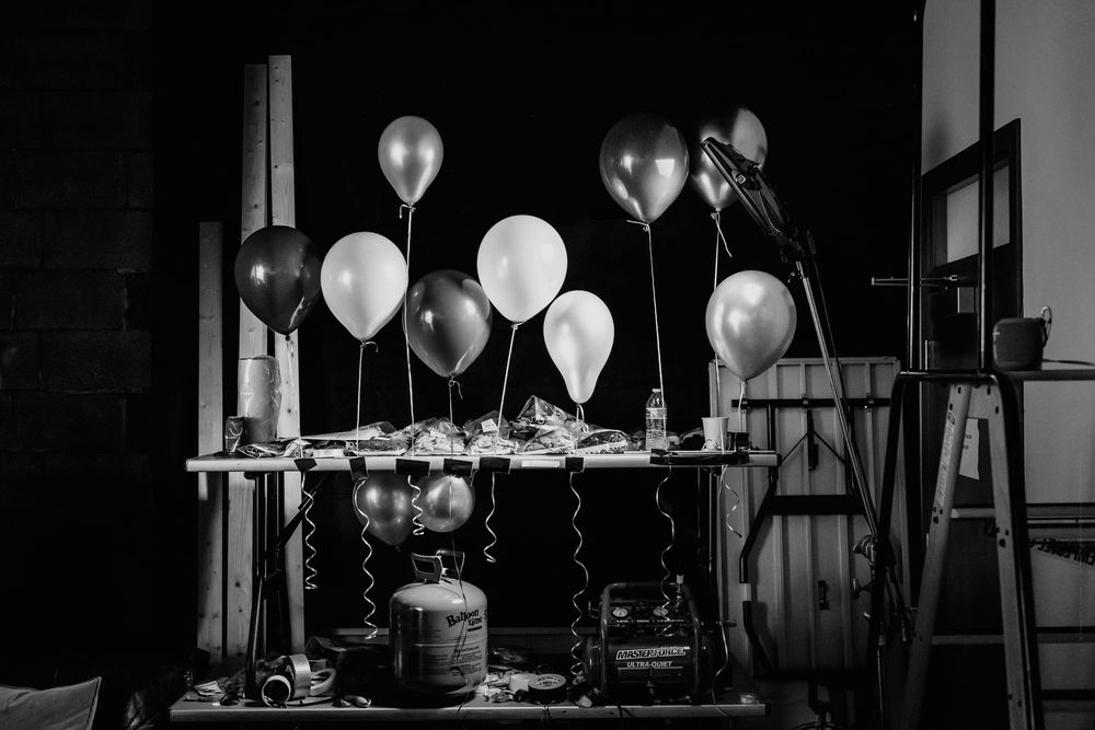 Balloons backstage with gas inflating black and white fine art photo.