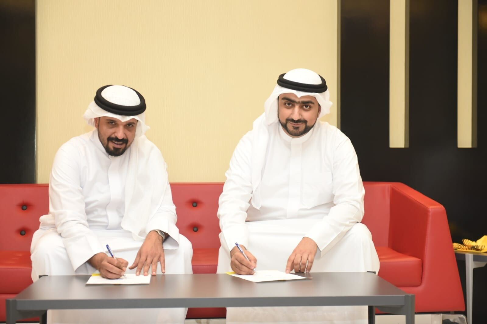 Ahmed Al- Aradi from Tap signing a sponsorship with Al Ahli Basketball Club