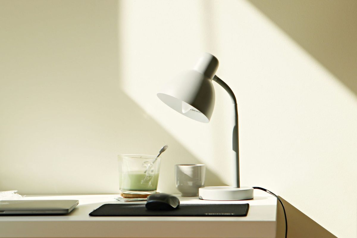 Minimalist desk work space with notepad