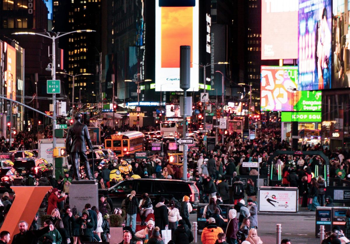 Crowds walking through streets of New York