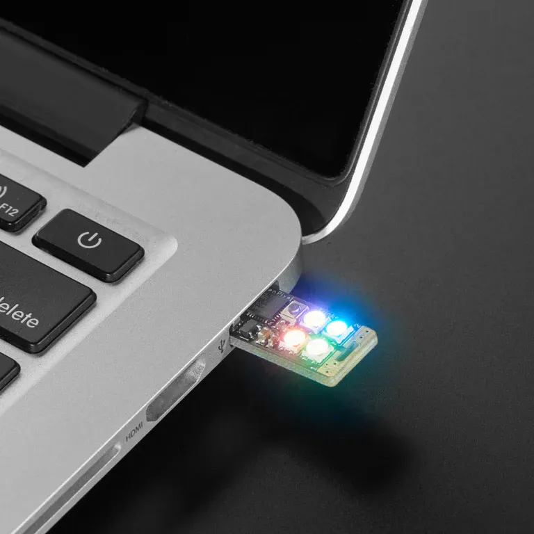 Adafruit Neo Trinkey with four NeoPixel LEDs