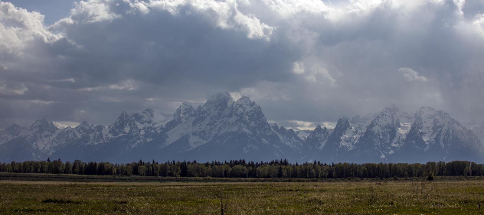 Rain and low cloud over the Teton Range above the sagebrush flats of Jackson Hole