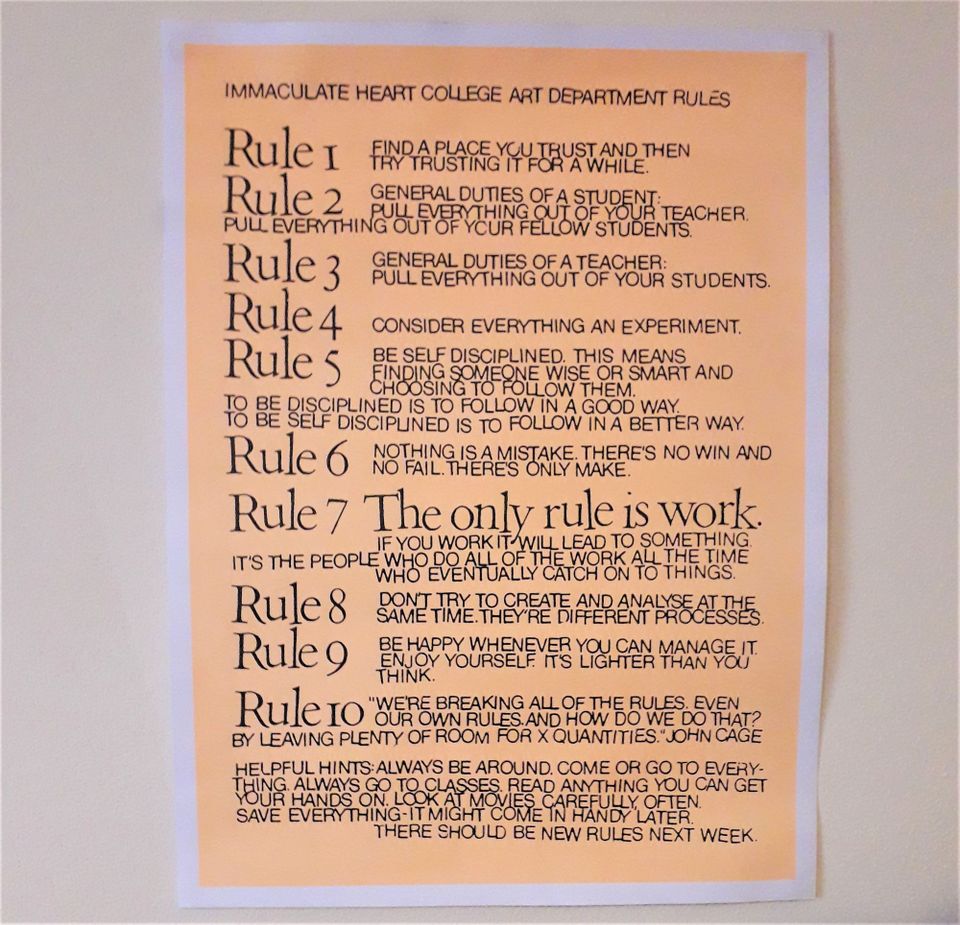 Photo of a poster with the rules transcribed in the article below in black type on orange
