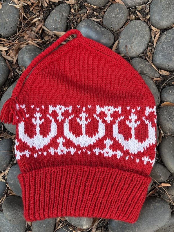A red "Melt the Ice" hat with Star Wars resistance logo added in a white stranded colorwork.