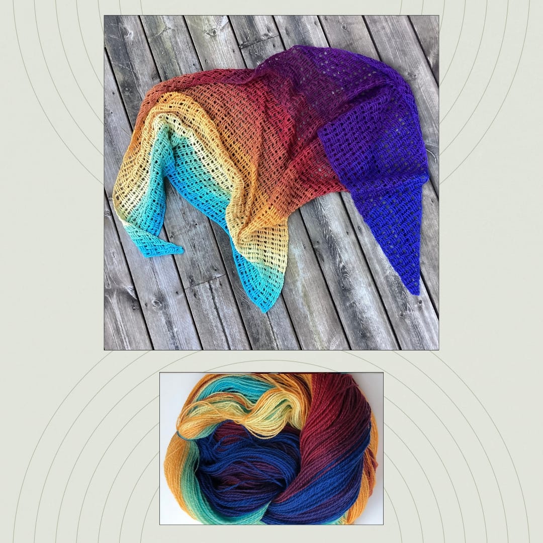 Colorful gradient crocheted shawl displayed next to the handspun yarn used to create it.
