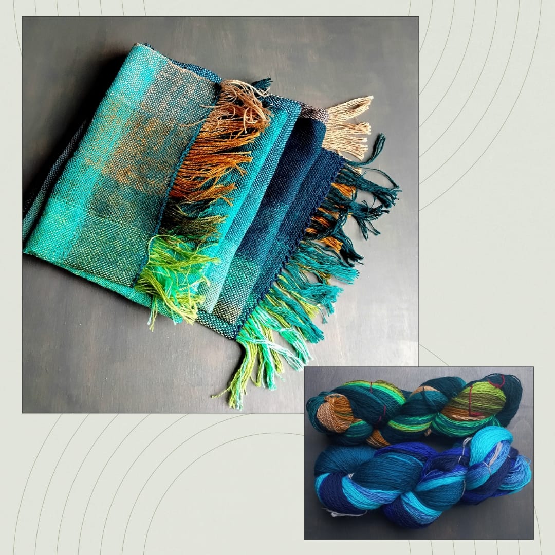 Finished handwoven scarf shown alongside the handspun yarns it was made from.