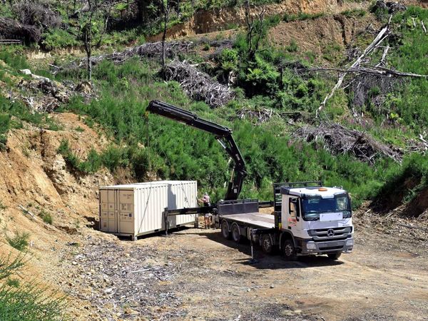 Container delivery with a big hoist truck