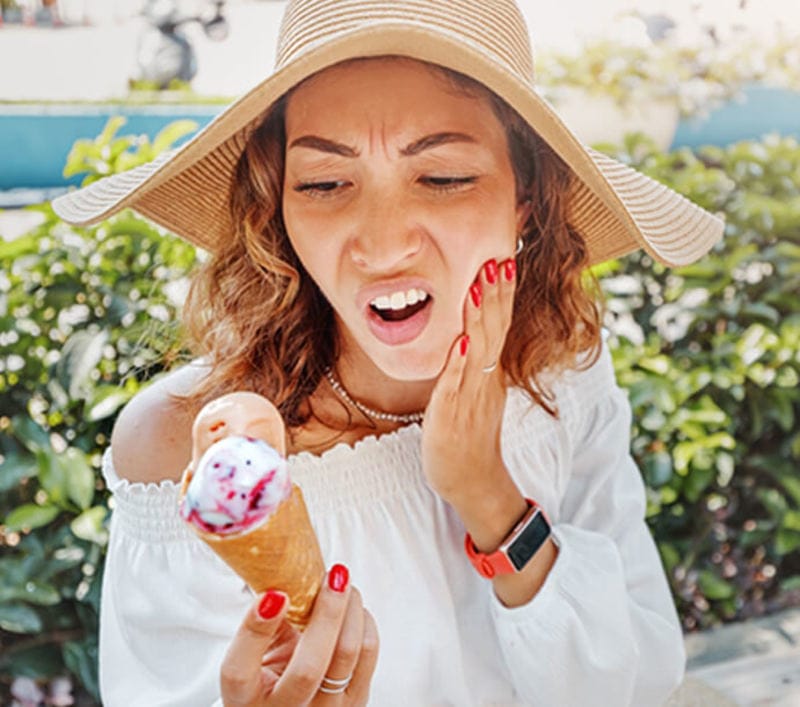 Woman with tooth sensitivity