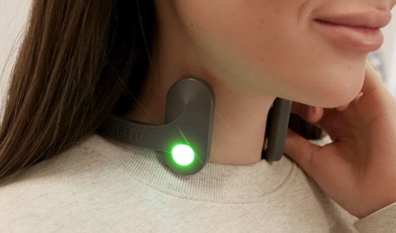 Woman using Pulsetto for panic attack, therapy for anxiety and depression