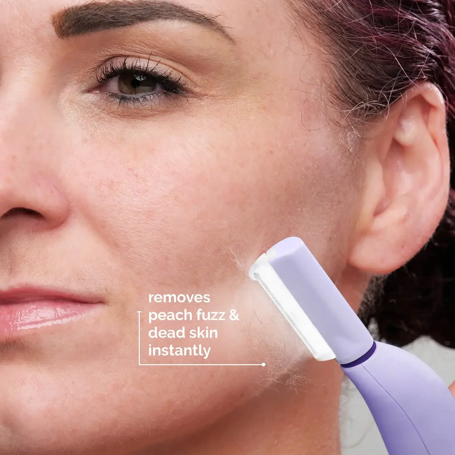 Woman using the Sonicsmooth to remove peach fuzz & dead skin