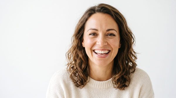 woman smiling confidently showing small gap between front teeth