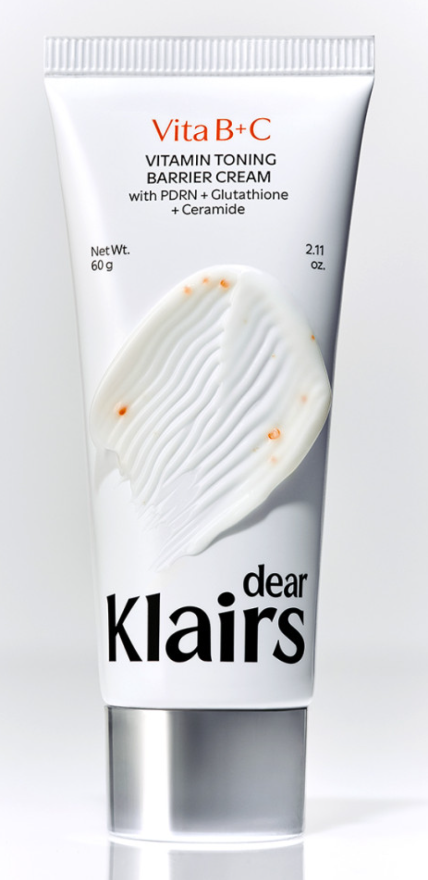 Dear Klairs Vitamin Toning Barrier Cream — textura de crema blanca con cápsulas de vitamina C naranjas