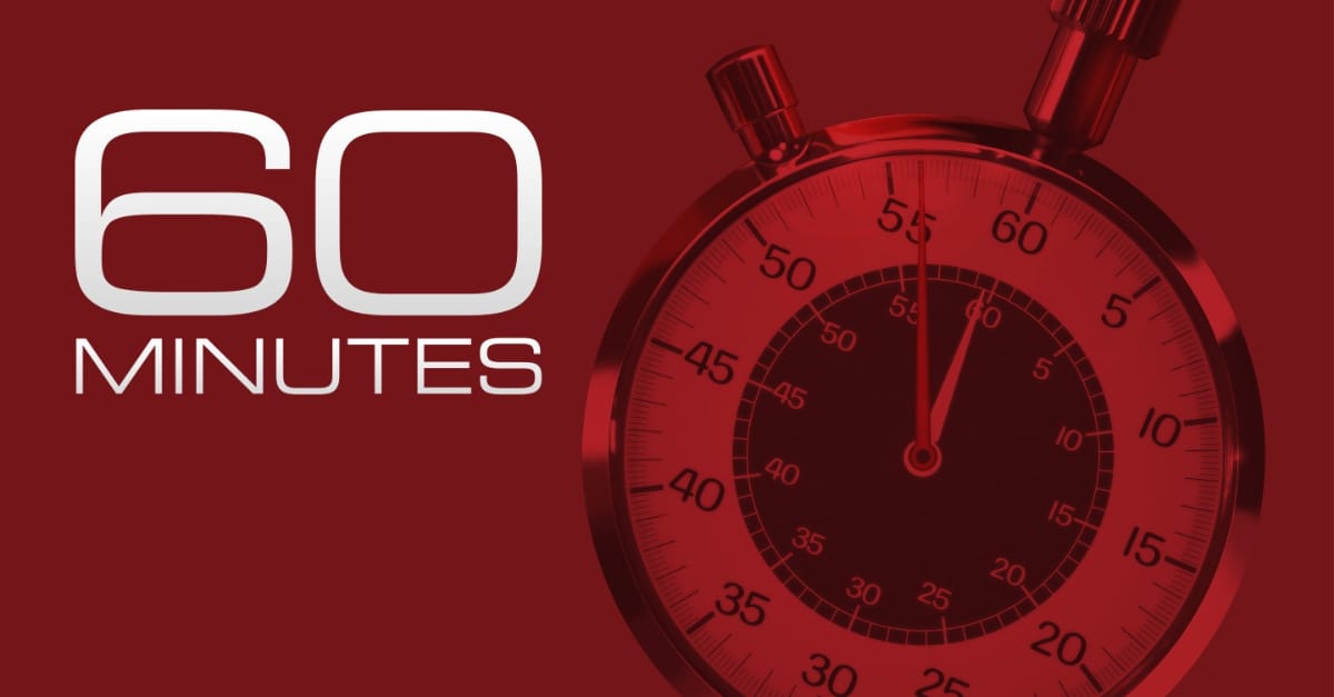 The 60 Minutes logo: white text reading "60 MINUTES" against a deep red background, beside a close-up of a red-tinted analog stopwatch.