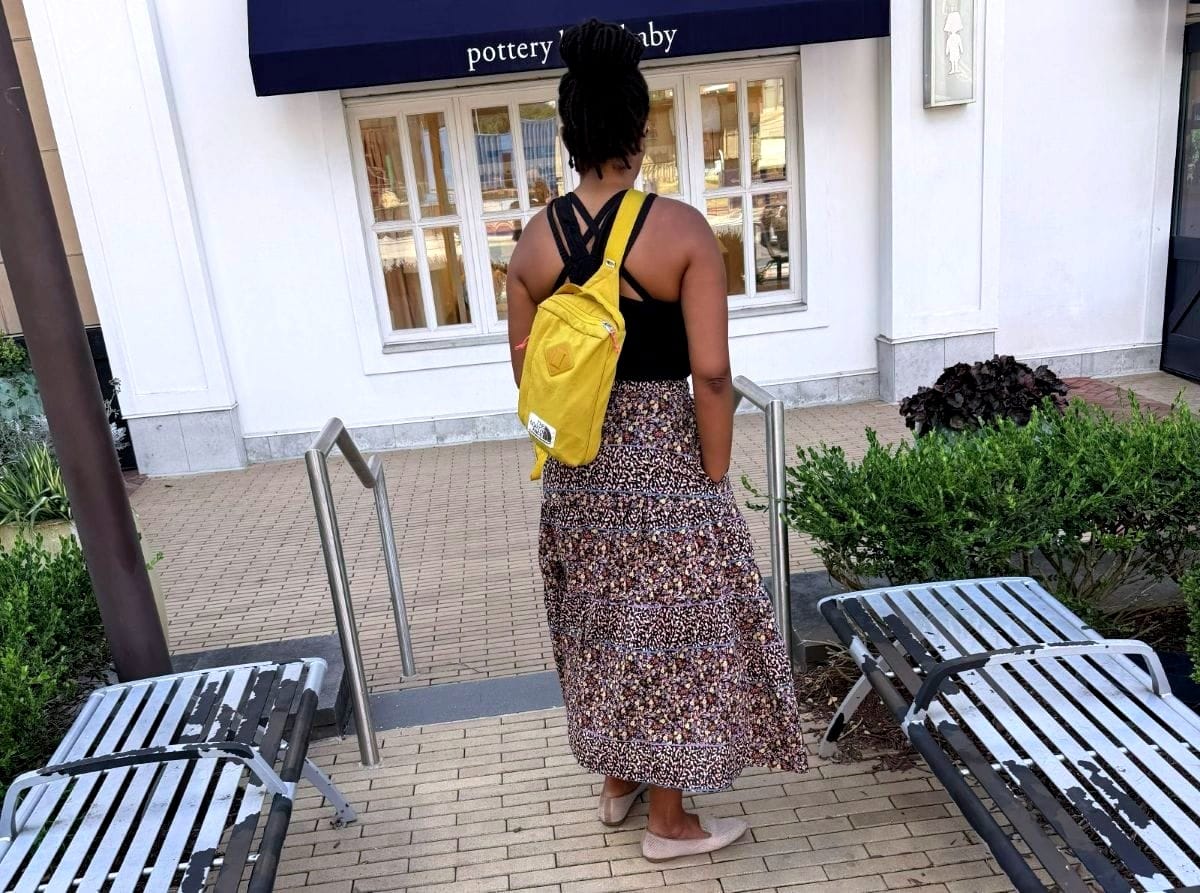 Back view of me wearing my handmade three-tiered Mave skirt. I have my hands in the pockets to show off that detail.