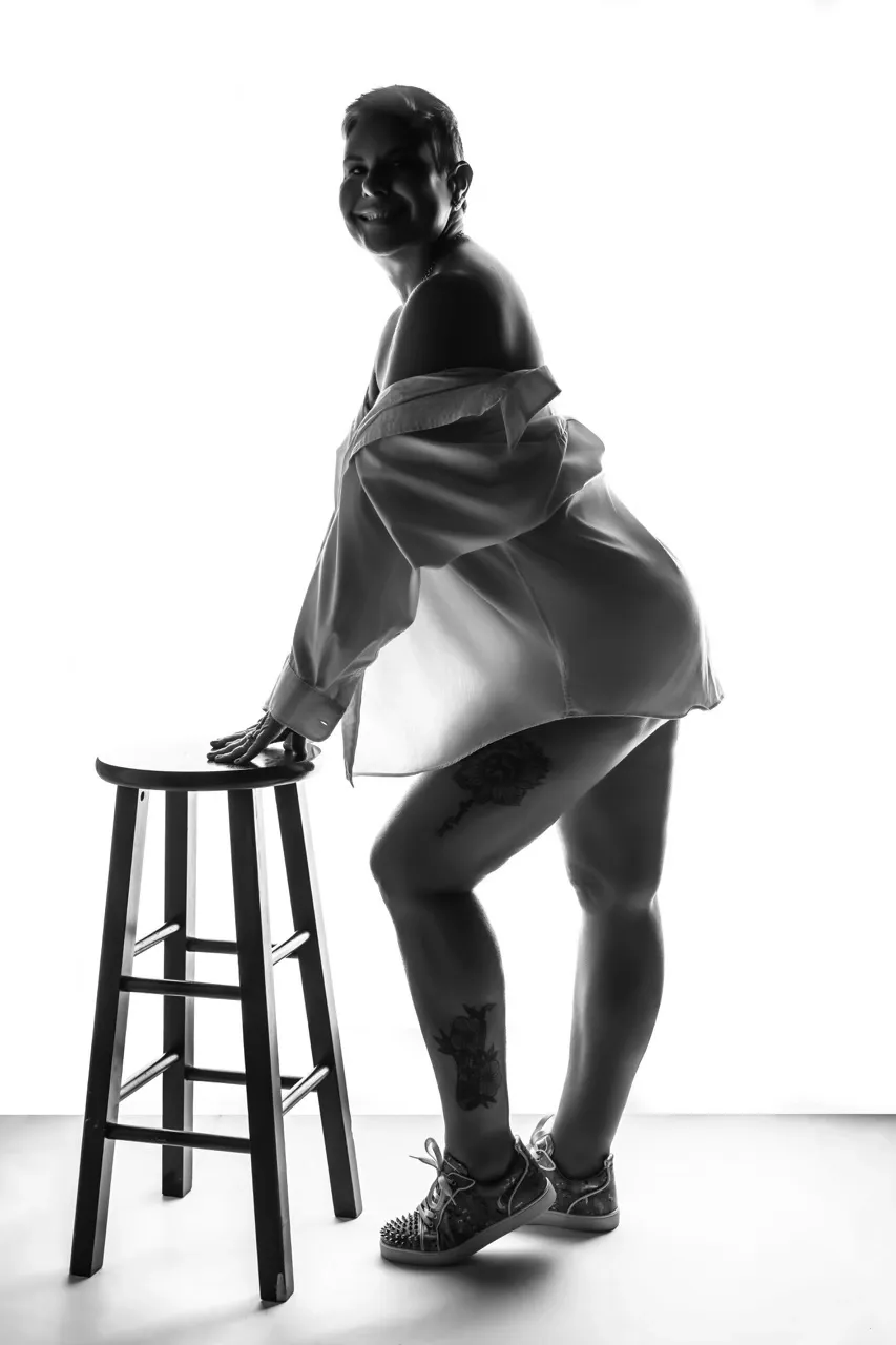 55 year old Florida woman celebrating body confidence during her boudoir photography session