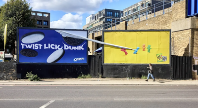Sour Patch Kids tear down the Oreo poster next door