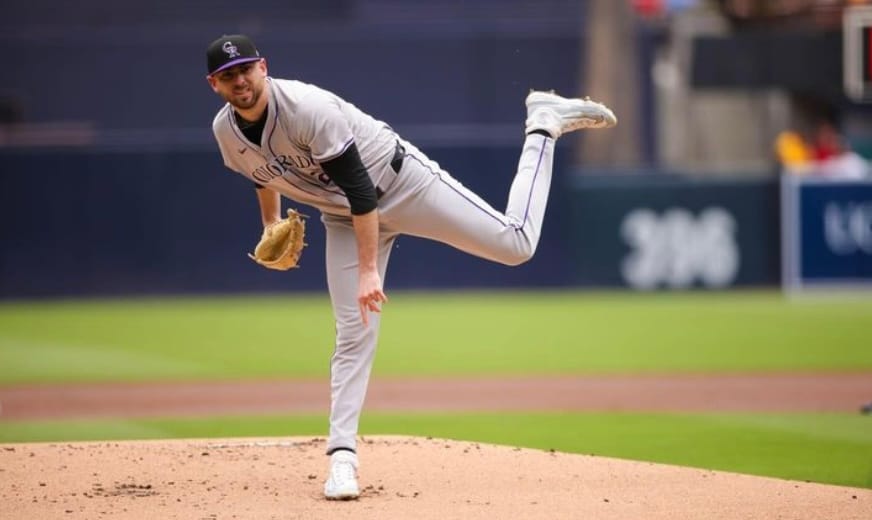Austin Gomber stands on the mound after throwing a pitch. He’s wearing road grays.