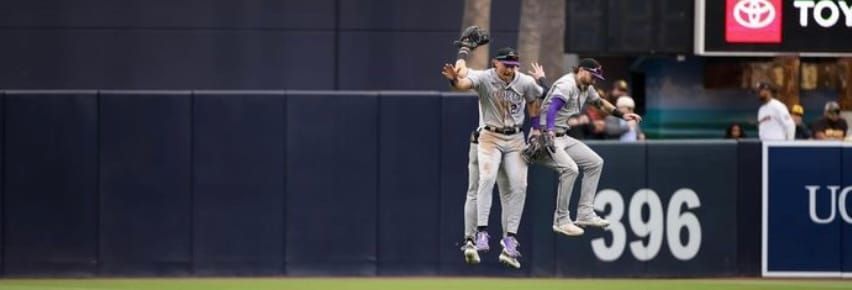 Doyle, Beck, and Cave jump in celebration. They’re wearing road grays.